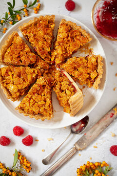 A Cornflake and Jam pastry tart cut into sclices.