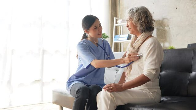 Healthcare concept, female doctor using stethoscope on patient to check lungs and heart rate of old woman patient at the hospital Talk therapy is a nursing review