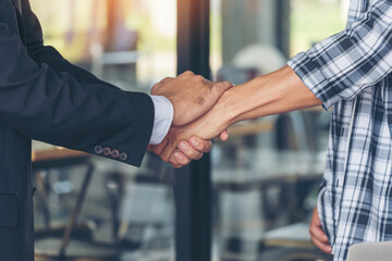 Teamwork partner two men team shaking hands together. Businessman contractor handshake with Business Partner Trust Partnership. Industrail people contractor dealing mission team meeting office desk