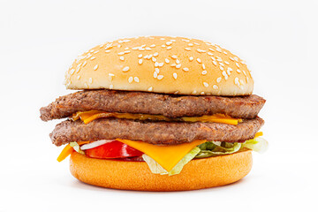 double cheeseburger with meat, lettuce, tomato and onion on white background