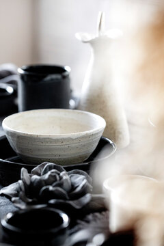 Rustic table setting with empty craft handmade ceramic tableware