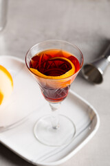 Boulevardier cocktail boozy bourbon whiskey, bitter and sweet vermouth with orange peel as garnish