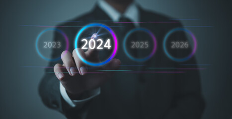 Hand Touching New Goals and Plans on Virtual Screen 2024 and numbers for Next Year Technology Concept