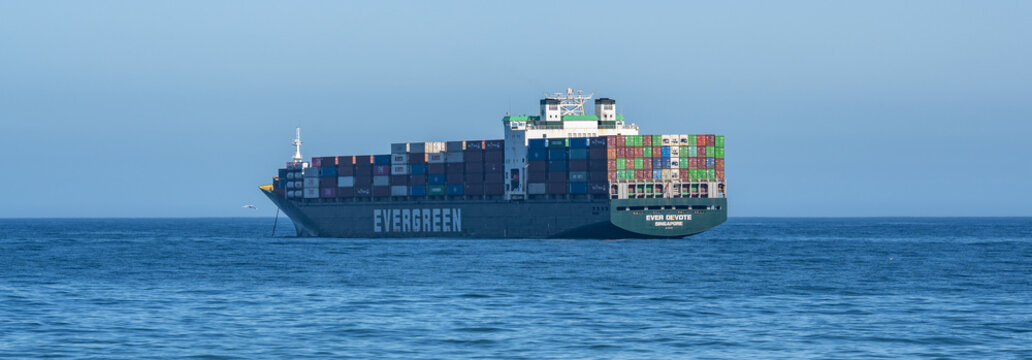 Cape Town, South Africa, February 23, 2023: Container ship from shipping company EVERGREEN with container anchored off Cape Town on the Atlantic Ocean