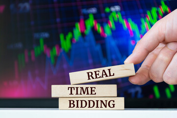 Naklejka premium Wooden blocks with words 'Real Time Bidding'. Business concept