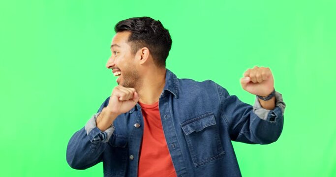 Happiness, dance and man portrait in green screen excited with music and smile. Isolated, studio background and happy male model with celebration, energy and dancing with freedom and hip hop move