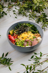 Portion of gourmet poke bowl with beef pastrami vegetables