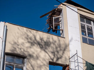 Destroyed wall against the blue sky.Footnote of the house . Replacement of the old with the new .