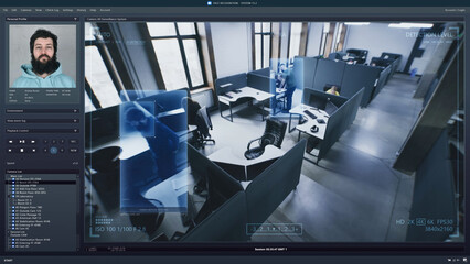 Playback office CCTV camera on computer. People work in coworking office. AI software with facial recognition and personal profiles. Security camera. Face scanning system. Surveillance and monitoring.
