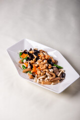 stir fried white shimeji mushroom with scallop black fungus cashew nut deep fried yam bean curd and mixed colourful vegetables on wood table asian Chinese vegan halal food banquet menu for restaurant