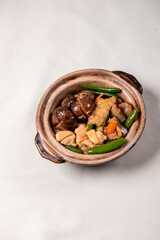 braised assorted dried seafood sea cucumber mushroom bean curd skin and broccoli mixed vegetables in sauce casserole on wood table asian chinese halal food banquet menu for restaurant