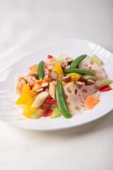 stir fried white shimeji mushroom with scallop black fungus cashew nut deep fried yam bean curd and mixed colourful vegetables on wood table asian Chinese vegan halal food banquet menu for restaurant