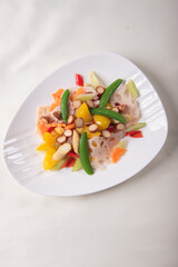 stir fried white shimeji mushroom with scallop black fungus cashew nut deep fried yam bean curd and mixed colourful vegetables on wood table asian Chinese vegan halal food banquet menu for restaurant