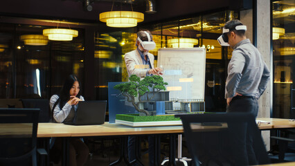 Diverse designers use VR headsets, make architectural project, create modern exterior design of hi-tech house in virtual reality cyberspace. 3D hologram. Future innovative digital AI technologies.