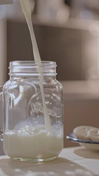 pouring milk into a glass