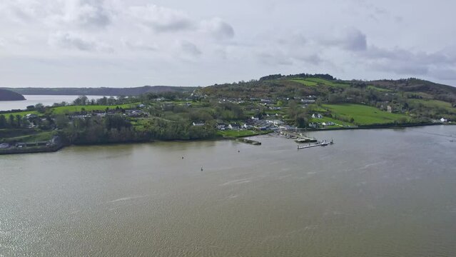 Waterford Estuary Ireland drone approaching Cheekpoint Village with the exit of the Estuary in the background and the Celtic Sea