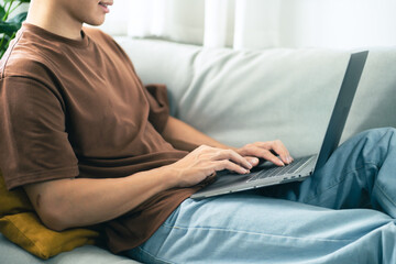 Naklejka premium Man work from home. work online on laptop. Asian businessman working online business concept with social distancing laptop online meeting.