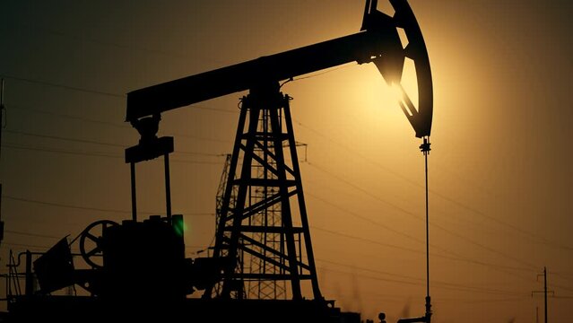 Business. Energy mining platform. Oil rigs in an oil field for extraction of fossil fuels and crude oil from underground. Tower with pump for fossil resources. Drilling ground research.Industrial oil