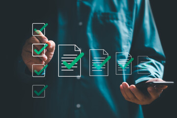 Document management and digital checklist concept ,Businessman mark digital checklist on virtual...