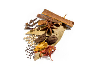 Indian spices for curry, gravy, biryani, cloves, star anise, white pepper, nagmate, mustered, Bay leaf, and nutmeg flower isolated on white background natural seasoning used in Indian cooking
