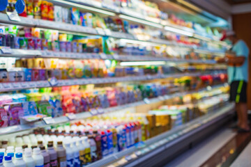 Defocused blur Male shopping milk in the for health a shopping shelf put on them at food