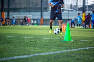 Soccer ball tactics cone on grass field with for training