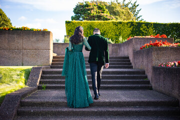 Afghani couple's wearing green wedding outfit back view