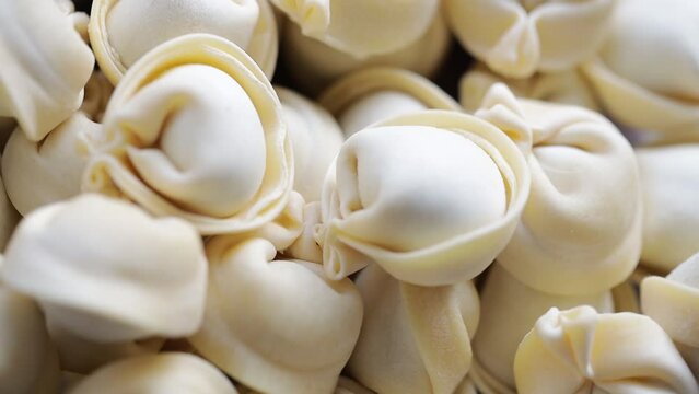 a bunch of homemade dumplings spin in a circle