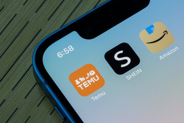 Portland, OR, USA - Apr 11, 2023: Temu, SHEIN, and Amazon app icons are seen on an iPhone. Temu, LLC is an American-based online marketplace and a subsidiary of Chinese-based PDD Holdings Inc.