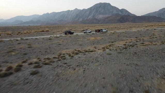 POV shot of desert of Balochistan with car and jeep stranded.