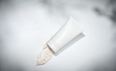 Plastic tube for cosmetic cream for hand and face. Care, cleaning and maintenance style. Decorative background concept.