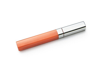 Orange mascara on the white isolated background.