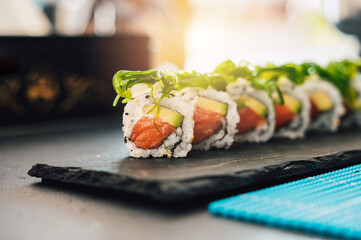 Close up of tasty japanese uramaki sushi with salmon