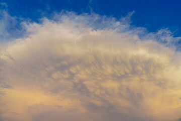 Large unusual cloud in the blue sky