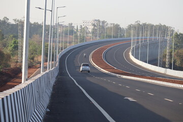 the indian highway road with one car going on it