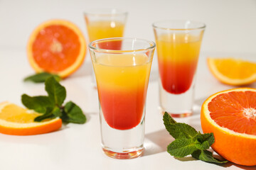 Shot with orange taste, tasty citrus shot concept