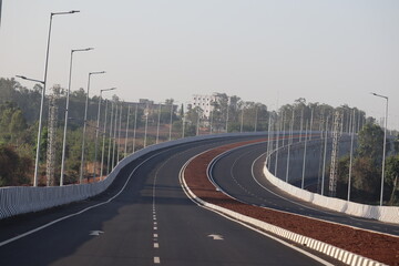 the empty highway road in india with no people and no vehicles with street lights