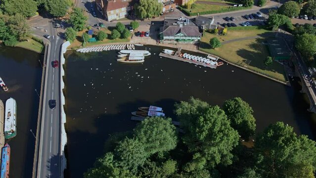 Aerial view orbiting over vehicles driving on Clapton historical archway canal bridge, England