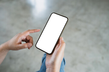 Hand holding empty white screen smart phone on white background.
