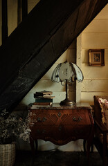 Old vintage interior with antique lamp and books
