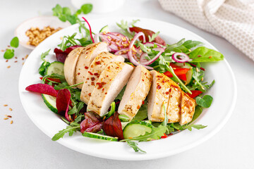Chicken breast grilled and fresh vegetable salad