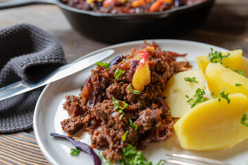 One pot ground beef red cabbage skillet with potatoes and sauteed apples on a plate