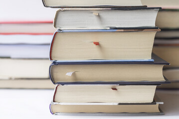 Books stacked vertically and horizontally. Pile of books.
