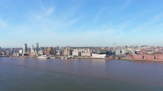 Liverpool, UK: Aerial view of famous city and seaport in England, skyline of Liverpool City Centre with high-rise buildings, sunny summer day - landscape panorama of United Kingdom from above