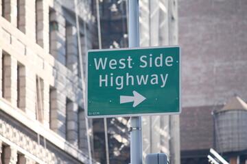 Green West Side Highway direction traffic sign in Manhattan in New York City
