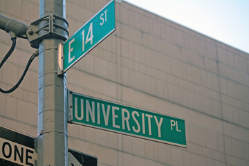 Green East 14th Street and University Place traditional sign in Midtown Manhattan