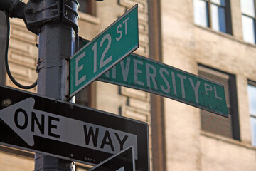 Green East 12th Street and University Place traditional sign in Midtown Manhattan