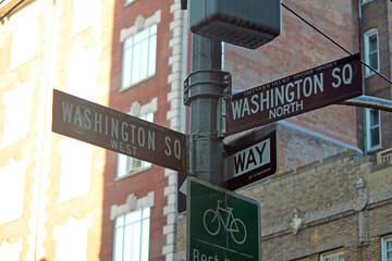 Brown Washington Square North and Washington Square West historic sign in Midtown Manhattan in New...