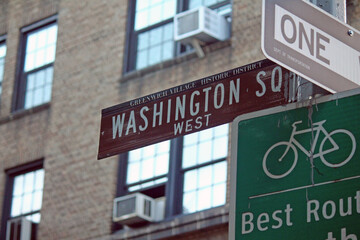Washington Square West brown traffic sign in New York in Greenwich village historic district