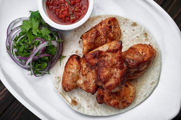 Mouth-watering chicken shish kebab with tangy tomato sauce